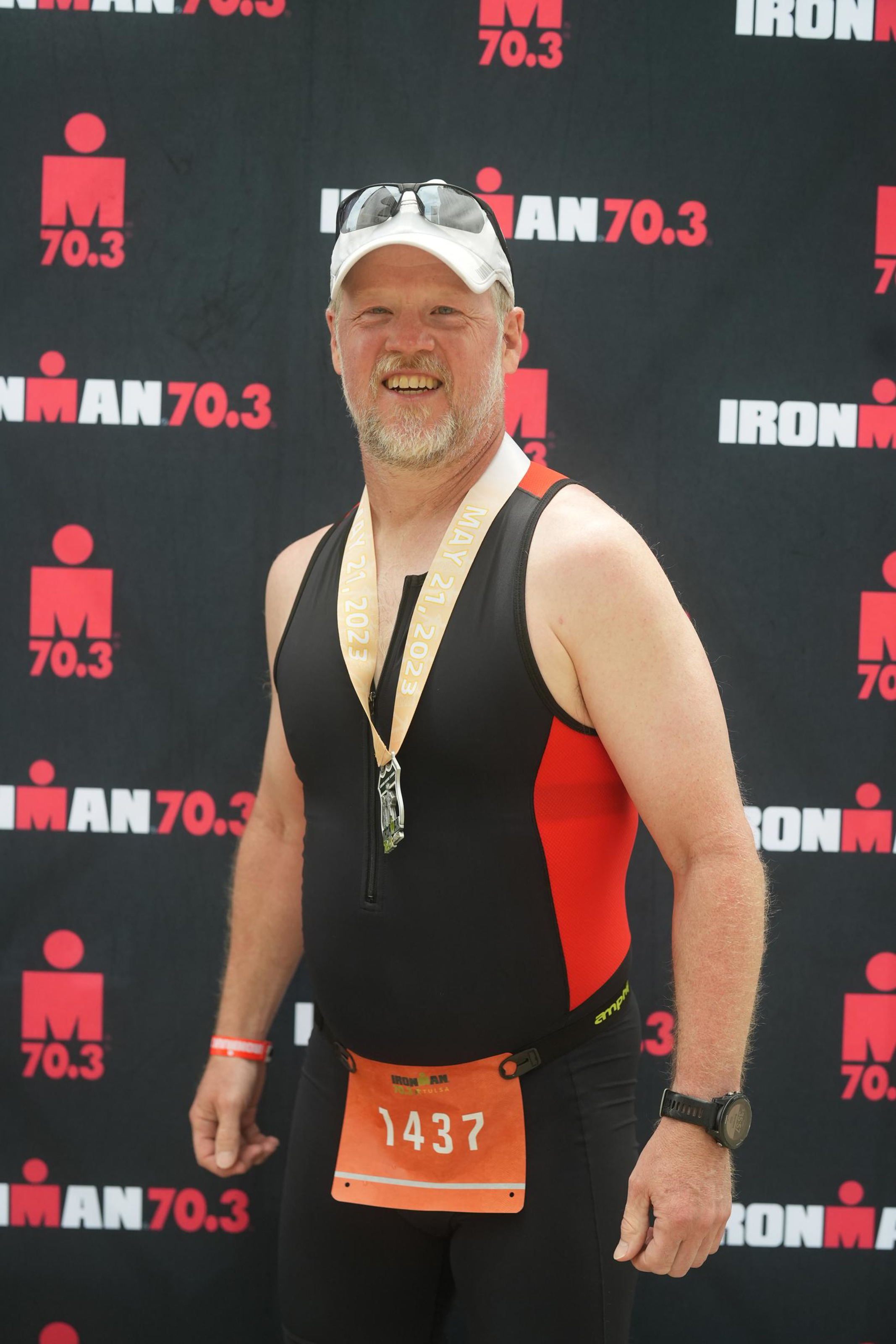Travis Berkley finishing a triathlon in Tulsa